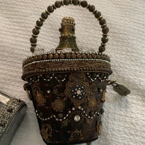 Mary frances champagne bucket purse.  Like new